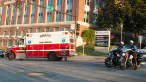 An ambulance transports Ashoka Mukpo, who contracted Ebola while working in Liberia, to the Nebraska Medical Center's on Oct 6, 2014.