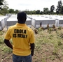 A man stands above a new Ebola treatment center in Monrovia, Liberia. Health workers in Liberia, the hardest-hit nation, have turned people away from treatment units because of shortages of beds and staff.