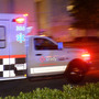 An ambulance carrying Amber Vinson, the second health care worker to be diagnosed with Ebola in Texas, arrives at Emory University Hospital in Atlanta on Wednesday.