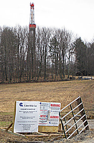Dimock PA drilling rig and signs