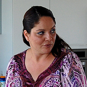 Adi Asulin stands in the kitchen of her family's remodeled apartment north of Tel Aviv. She saved thousands of dollars by flying to China to buy furnishings and flooring directly from manufacturers.