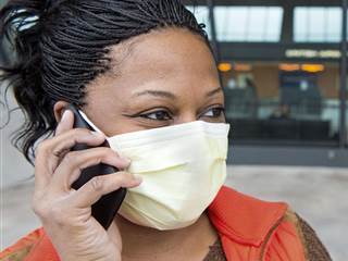 'Extra Precaution': Worried About Ebola, Airline Travelers Don Masks