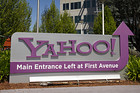 Flags fly above Yahoo! Inc. signage displayed at the company's headquarters in Sunnyvale, California, U.S., on Tuesday, April 16, 2013. Yahoo! Inc., the biggest U.S. Web portal, forecast sales that fell short of analysts? estimates as it continued to lose advertisers to Google Inc. and Facebook Inc. Photographer: David Paul Morris/BloombergA pedestrian walks in front of the Yahoo! Inc., headquarters in Sunnyvale, California, U.S., on Tuesday, April 16, 2013. Photographer: Yahoo! Inc., is expected to release earnings data on April 16. David Paul Morris/Bloomberg