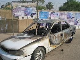 A car still at a traffic circle in central Baghdad where a shoot-out with private security company Blackwater left 9 Iraqis dead and 15 injured. Witnesses said a woman and child were killed in the car. Iraqi officials said they were yanking the license of North Carolina-based Blackwater Security over the incident, saying the Blackwater guards had fired indiscriminately into crowds of pedestrians. (Hussein Kadhim/MCT)