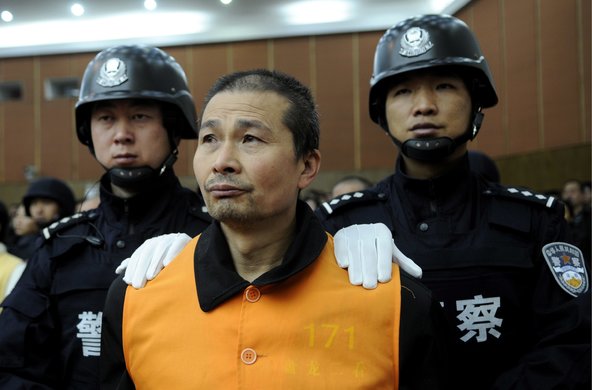 Jiang Jiatin, accused of leading a criminal gang, listened as he was sentenced to death in a court in Kunming, Yunnan Province, in 2009.