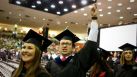 David Stewart, of Houston, waves to friends and family as he walks to his seat with other University of Houston students who are graduating during the Spring 2012 Commencement, Friday, May 11, 2012, in Houston. The colleges of Technology, Education and Hotel and Restaurant Management graduated at the 2 p.m. slot. The College of Business, Law and Optometry graduate tomorrow.( Nick de la Torre / Houston Chronicle )