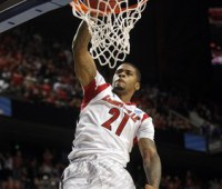 University of Louisville's Chane Behanan dunks the basketball over the North Carolina A&T's defense during the first half of their second round NCAA basketball game at the Rupp Arena in Lexington