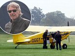 Harrison Ford seen out at an airfiled working on a plane before taking it flying....\n\nPic: Greg Brennan 07930877317