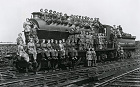 Women locomotive cleaners grouped upon a 4-4-2 'High Flyer' Class locomotive, No 1406, at the Low Moor engine shed near Bradford, West Yorkshire, 23 March, 1917