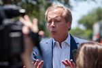 Candidate for Lieutenant Governor David Dewhurst addresses the media in the parking lot of an Austin HEB before voting early in the 2014 runoffs, May 19, 2014.