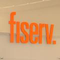 Fiserv posts improved profits, raises 2014 outlook