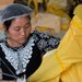 A woman at a factory in Anqiu, China, sewed protective suits last week for medical workers.