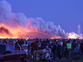 Spectators Look On in Shock as Antares Rocket Explodes