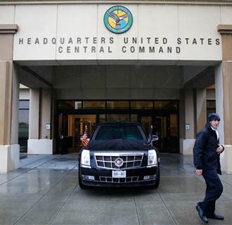 Image: The vehicle of U.S. President Barack Obama sits in front of the building while he is inside in a briefing from top military leaders at U.S. Central Command at MacDill Air Force Base in Tampa