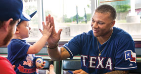 Michael Choice signing an autograph for a fan