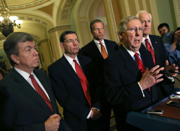 Senate Minority Leader Mitch McConnell (R-KY) (2nd-R) speaks to reporters while flanked by (L-R), Sen. Roy Blunt (R-MO), Sen. John Barrasso (R-WY) Sen. John Thune (R-SD) and Sen. John Cornyn (R-TX) after attending the weekly Republican policy luncheon at the U.S. Capitol on February 4, 2014 in Washington, DC. (Mark Wilson/AFP/Getty Images)