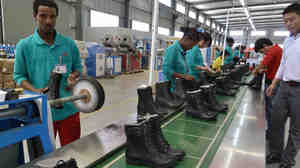 People working on the assembly line in April 2012 at Huajian shoe factory in Dukem, Ethiopia.