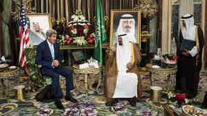 U.S. Secretary of State John Kerry speaks with Saudi King Abdullah bin Abdul Aziz al-Saud as the Saudi ambassador to the United States, Adel al-Jubeir, listens before a meeting at the Royal Palace in Jiddah, Saudi Arabia, on Sept. 11.