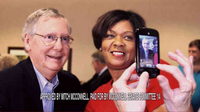 Sen. Mitch McConnell, R-Ky., poses with constituent Noelle Hunter. In a campaign ad, Hunter explains that McConnell helped get her daughter back from Mali after a custody battle.