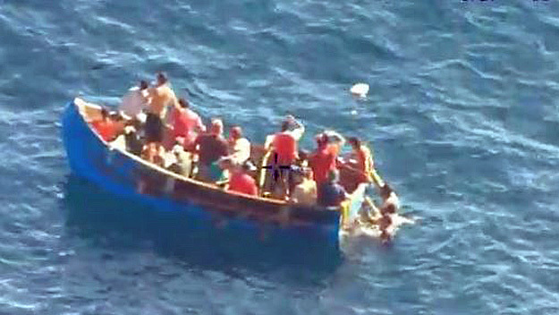 PBSO Marine Unit over migrants who were rescued off this boat on October 29, 2014. (Source: CBS4)