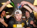 Justin Wilson #37 of the Pittsburgh Pirates and his teammates celebrate clinching a National League playoff spot after their 3-2 win over the Atlanta Braves at Turner Field on September 23, 2014 in Atlanta, Georgia. (Photo by Kevin C. Cox/Getty Images)