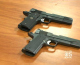 An Airsoft pistol (top) is placed alongside a pistol used by Richmond Police. (CBS)