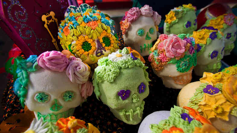 Elaborately decorated skulls are crafted from pure sugar and given to friends as gifts. The colorful designs represent the vitality of life and individual personality.