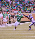 Senior wide receiver Brelan Chancellor blocks a Middle Tennessee opponent while running the ball during Saturday’s home game. Photo by Ryan Vance / Staff Photographer