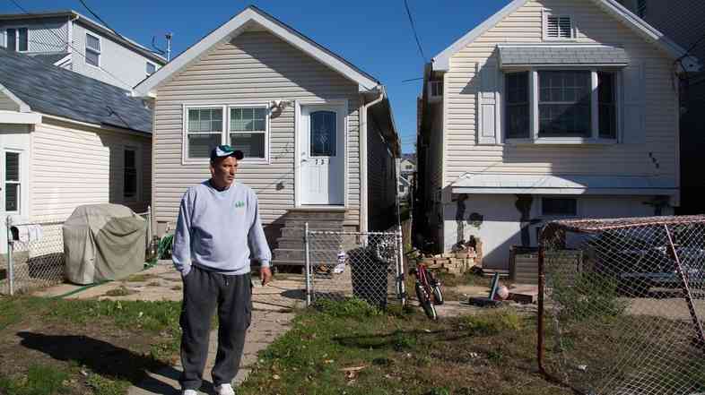 Stephen Drimalas stands outside his former home in Staten Island's Ocean Breeze neighborhood. He rebuilt his home after Superstorm Sandy but recently decided to sell it to the state of New York.