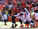 Crockett Gillmore #80 of the Baltimore Ravens is gang tackled by the Cincinnati Bengals defense during the first quarter. (Photo by Andy Lyons/Getty Images)