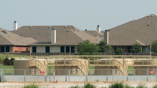 A gas well last fracked in March sits 385 feet from Debbie Ingram's home in Argyle, Texas on July 22, 2014.