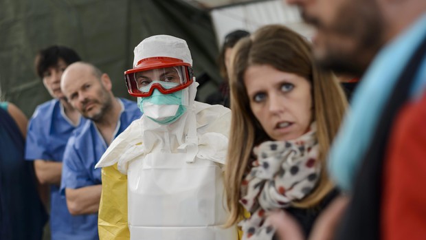 Health workers of the International Federation of Red Cross (IFRC) and medical charity Medecins Sans Frontieres (MSF) take part in a pre-deployment training for staff heading to Ebola areas on Oct. 29, 2014 at the IFRC headquarters in Geneva.