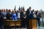 New York City Mayor Bill De Blasio (D) and members of the US Conference of Mayors gather at New York City's Gracie Manion in August 2014. (Courtesy US Conference of Mayors)