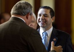 US Congressman Henry Cuellar (D-TX 28th District) speaks with Rep. Doug Miller R-New Braunfels, during a visit to the Texas Capitol on February 19th, 2013.
