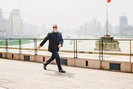Michael Kors on the terrace of his suite at the Peninsula hotel, overlooking the famous Bund, a scenic waterfront destination in central Shanghai.