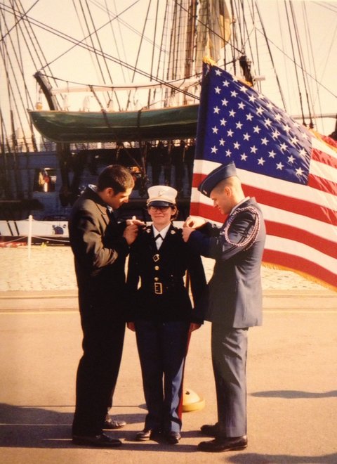 Teresa Fazio receiving her Marine Corps commission in 2002, with her two brothers, Chris on the left and Mike on the right.  