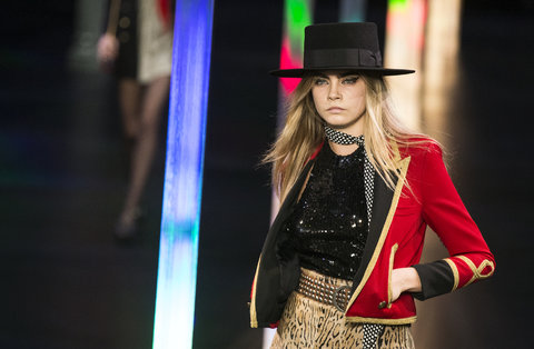 She's not just a Mulberry girl: Cara Delevingne on the runway for Saint Laurent last month.