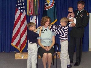 Colonel McMahon and her family during a promotion ceremony before her husband's death.