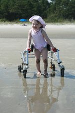 Katherine Faughn with her walker on the beach.