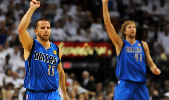 Jose Barea (L) and Dirk Nowitzki (R) of the Dallas Mavericks celebrate a point against the Miami Heat during Game 6 of the NBA Finals on June 12, 2011 at the AmericanAirlines Arena in Miami, Florida. (Photo: DON EMMERT/AFP/Getty Images)