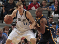 Dirk Nowitzki of the Dallas Mavericks posts up against David West of the Indiana Pacers on October 12, 2014 at the American Airlines Center in Dallas, Texas. (credit: Danny Bollinger/NBAE via Getty Images)