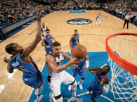 DALLAS, TX - OCTOBER 10: Chandler Parsons #25 of the Dallas Mavericks goes in for the lay up against Kevin Durant #35 of the Oklahoma City Thunder on October 10, 2014 at the American Airlines Center in Dallas, Texas.  (Photo by Glenn James/NBAE via Getty Images)
