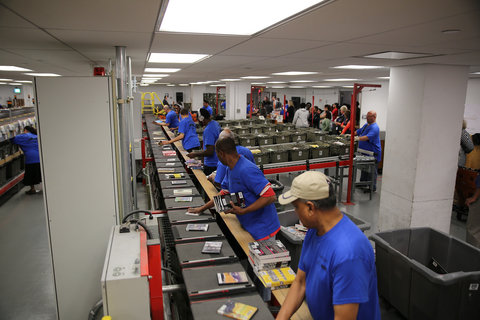 Workers sorting books during the competition.