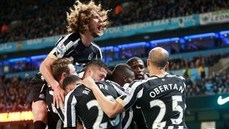 Newcastle players celebrate goal against Manchester City