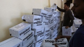 Employees of Snapdeal, an online retailer, sort out delivery packages inside their company fulfilment centre in Mumbai October 22, 2014. REUTERS/Shailesh Andrade