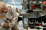 A technician works on an engine at the Ferrari plant in Maranello, Italy.