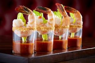 Dallas Chop House's jumbo shrimp cocktail features poached jumbo shrimp, Bloody Mary ‘cocktail sauce and ahorseradish-chili salt rim. 