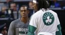 Peter May: "There are Celtics’ fans out there who care about the team. But in the current New England sports solar system, the Celtics are whatever comes after Pluto." Pictured: Boston Celtics guard Rajon Rondo, left, talks with forward Gerald Wallace during a preseason game in Boston, Wednesday, Oct. 22, 2014. (Elise Amendola/AP)