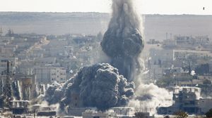 An explosion following an airstrike is seen in the Syrian town of Kobani from near the Mursitpinar border crossing on the Turkish-Syrian border in the southeastern town of Suruc, in Sanliurfa province, on Wednesday.