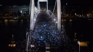 Thousands participants march accross the Elisabeth bridge during an anti-government rally against the government's plan to tax Internet usage.